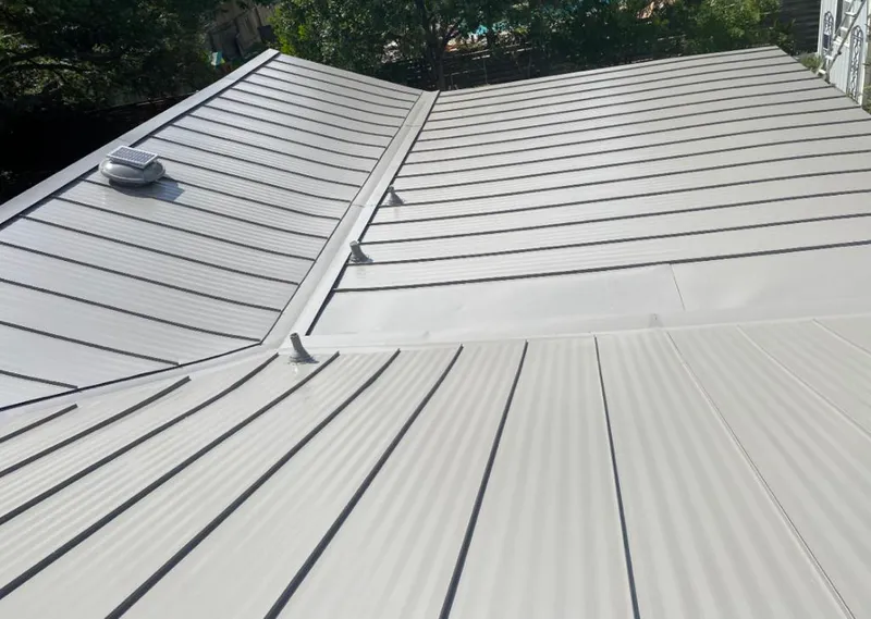 Solar attic fan installed on a metal roof for Roof Ventilation in Pocono